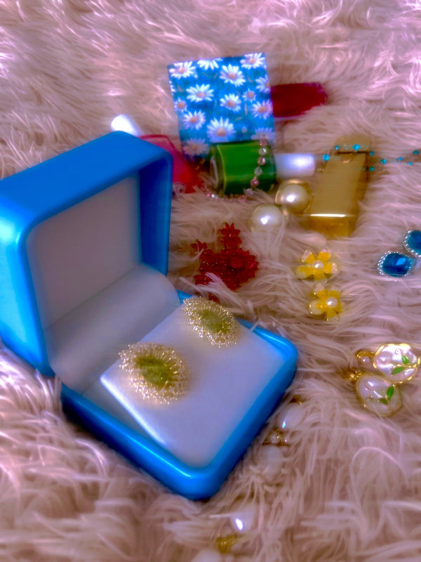 Someday she "Little Wish Jewelry" collection - Green and gold stud earrings in a vintage blue box on a soft pink aesthetic background, symbolizing artifacts of a dream.