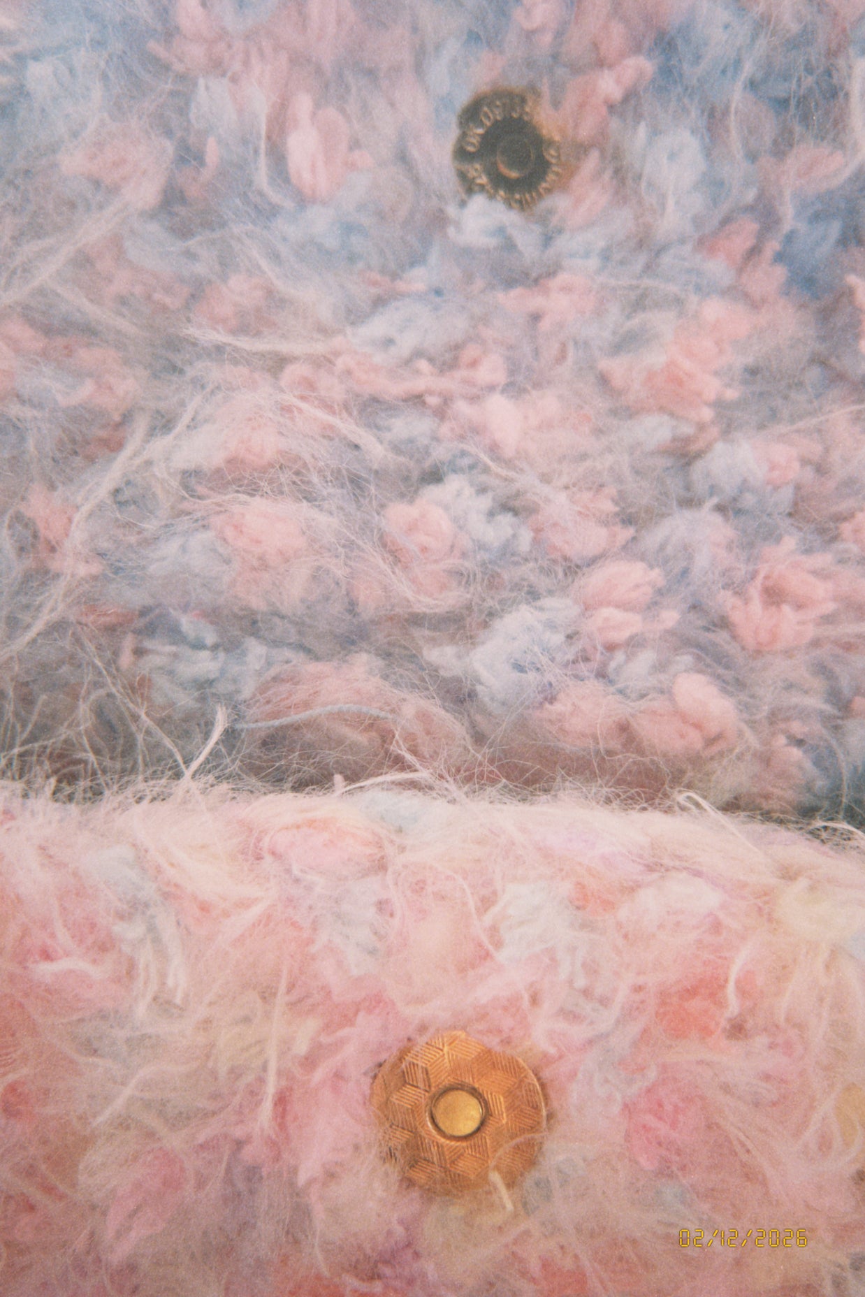 Close-up of textured fabric with pink and gray colors